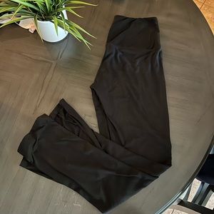 Two black legging. One is lower and another is high waisted.